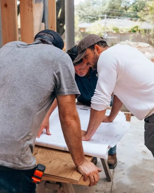 Team reviewing construction plans